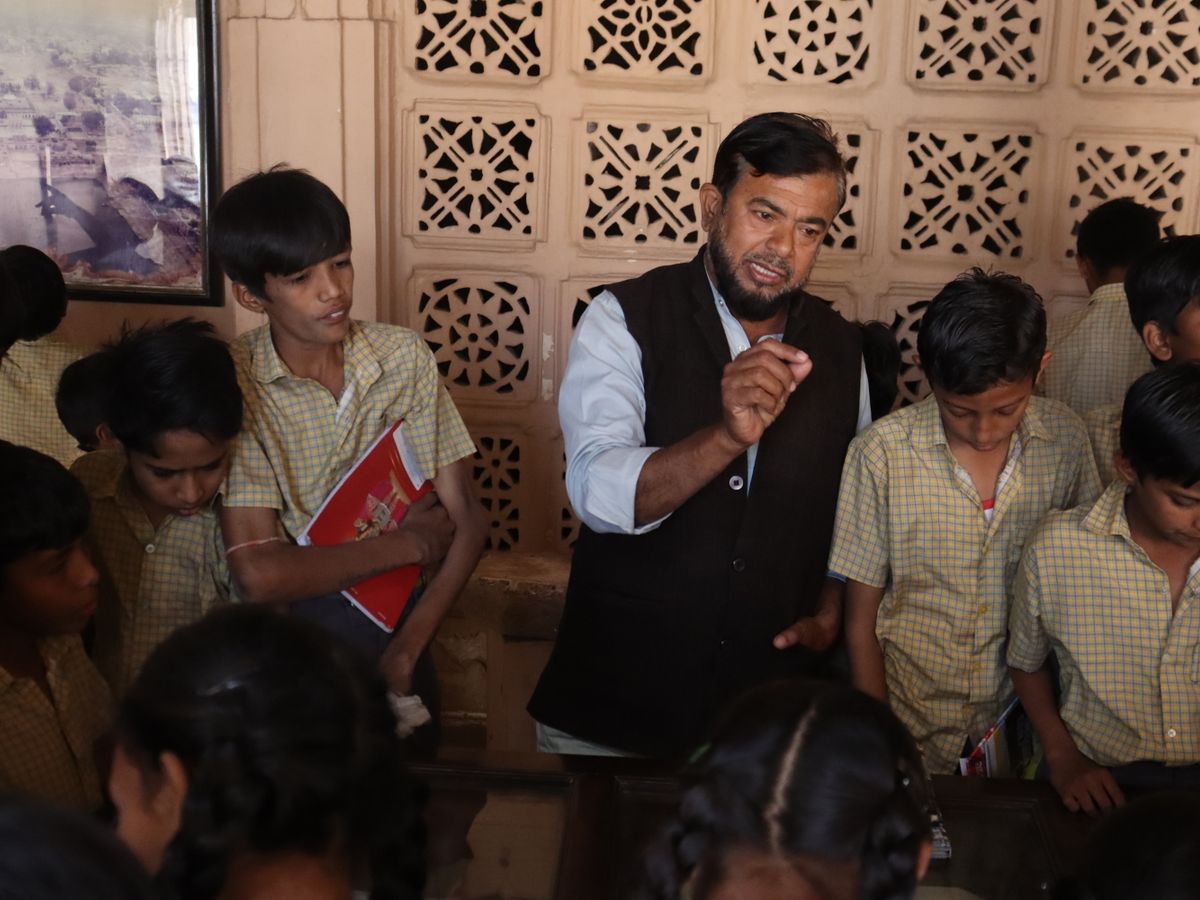 Teacher with students